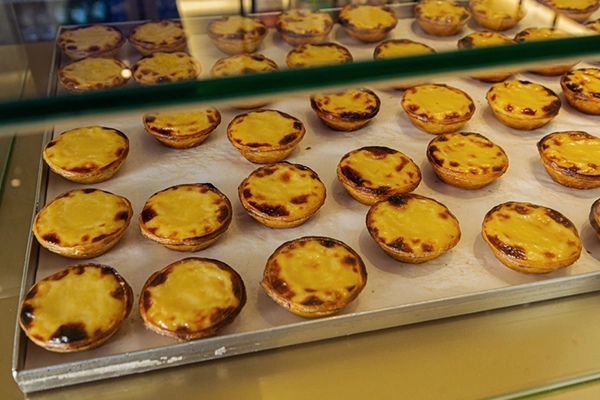 Portuguese egg tart pastry dusted with cinnamon, pastéis de nata
