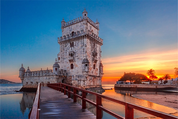 Belem Tower or Tower of St Vincent on the bank of the Tagus River at scenic sunset, Lisbon, Portugal
